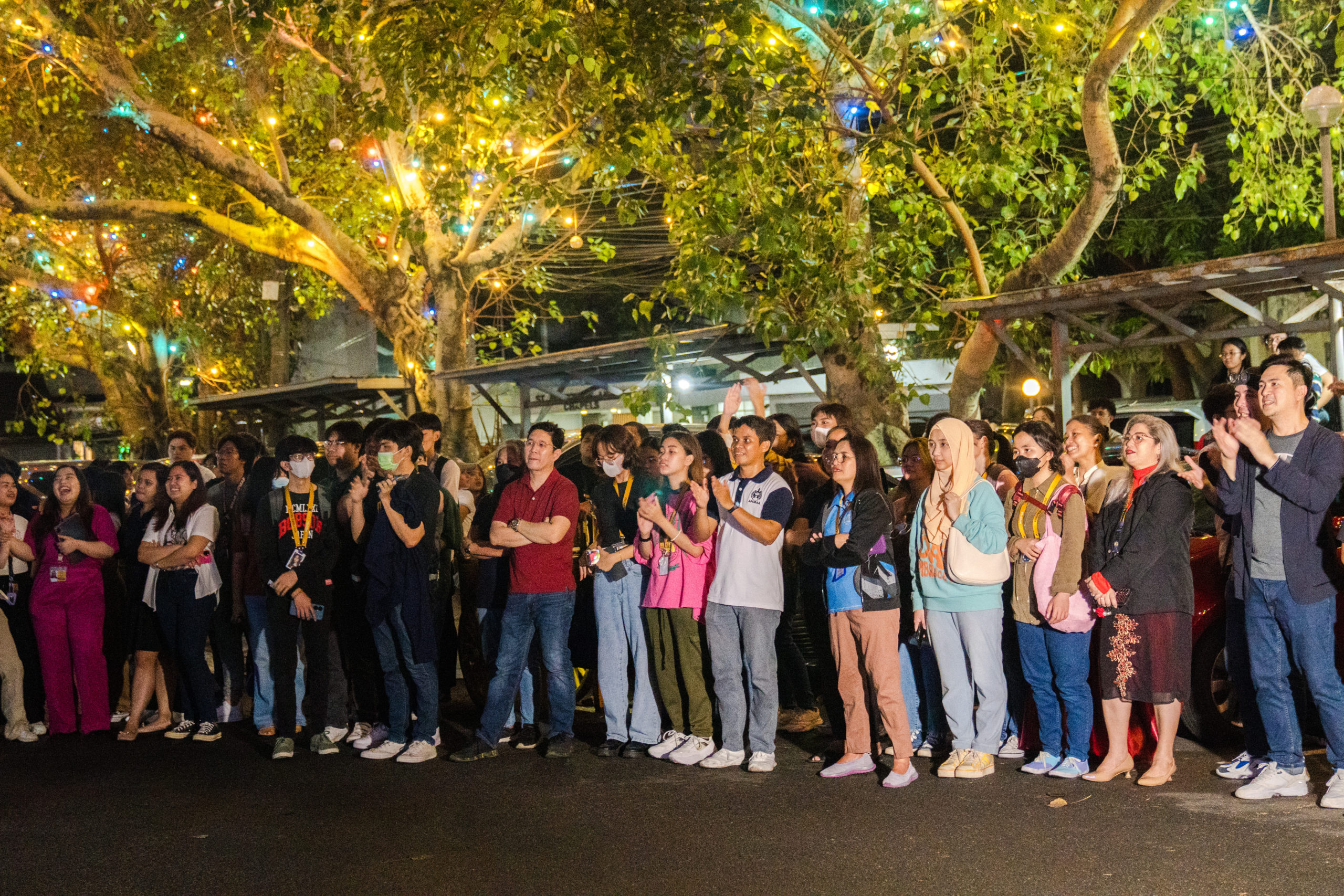 The APC community watches ‘Christmas Never Ends’ together at Humabon Parking Lot during the annual Christmas Lighting Ceremony. Photo by Johann Avery Marcalas